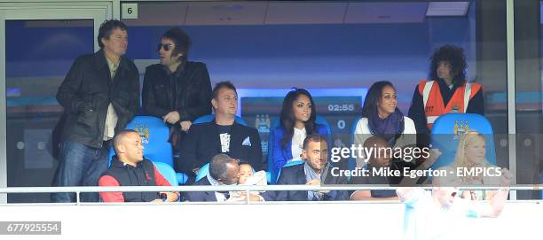 Carla Higgs, wife of Manchester City's Vincent Kompany sits with his father and brother in a private box along with OASIS singer Liam Gallagher