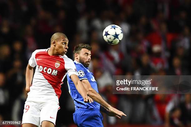Monaco's French forward Kylian Mbappe fights for the ball against Juventus' defender from Italy Andrea Barzagli during the UEFA Champions League...