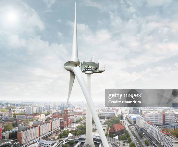 wind turbine in berlin tv tower - television tower berlin stock pictures, royalty-free photos & images