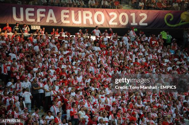 Polish fans watch the end of the game against Greece