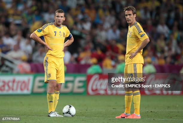 Ukraine's Andriy Shevchenko and Marko Devic wait to restart the game after conceding their first goal