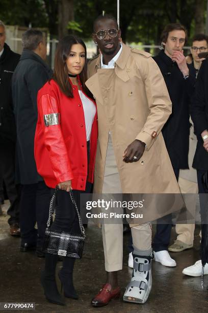 Footballer Mamadou Sakho and his wife Majda arrives at the Chanel Cruise 2017/2018 Collection at Grand Palais on May 3, 2017 in Paris, France.