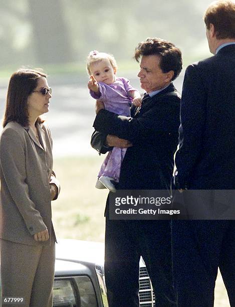 Actor Robert Blake holds Rose Lenore Sophie Blake, the daughter he fathered with his slain wife Bonny Lee Bakley, during a brief funeral ceremony for...