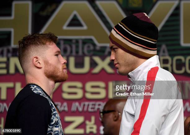 Boxers Canelo Alvarez and Julio Cesar Chavez Jr. Face off during a news conference at the KA Theatre at MGM Grand Hotel & Casino on May 3, 2017 in...