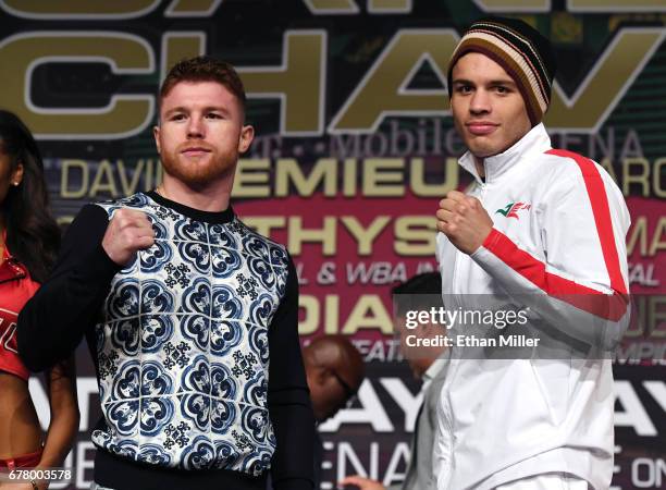 Boxers Canelo Alvarez and Julio Cesar Chavez Jr. Pose during a news conference at the KA Theatre at MGM Grand Hotel & Casino on May 3, 2017 in Las...