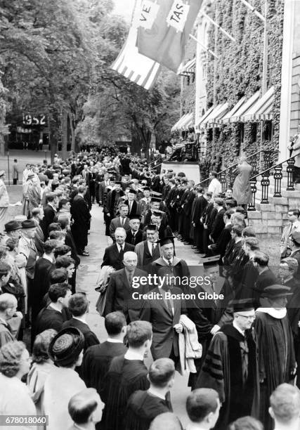 Honorary degree recipients at Harvard University walk past University Hall on their way to exercises during the 1962 Harvard commencement on Jun. 14,...