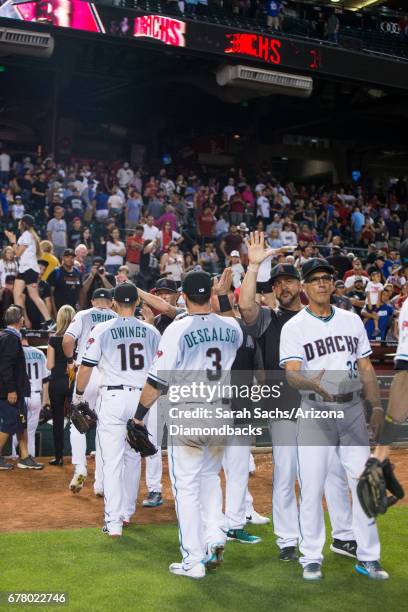 The Arizona Diamondbacks celebrate after defeating the Los Angeles Dodgers at Chase Field on April 21, 2017 in Phoenix, Arizona.