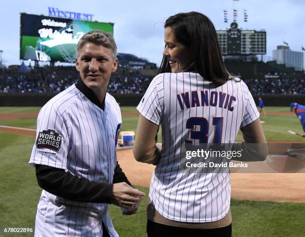 Former tennis player and French Open champion Ana Ivanovic and Chicago Fire Soccer player Bastian Schweinsteiger on the field before the game between...