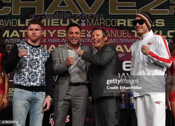 Boxer Canelo Alvarez, Chairman and CEO of Golden Boy Promotions Oscar De La Hoya, former boxer Julio Cesar Chavez Sr. And his son, boxer Julio Cesar...