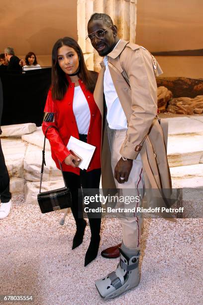 Football player Mamadou Sakho and his wife Majda attend the Chanel Cruise 2017/2018 Collection Show at Grand Palais on May 3, 2017 in Paris, France.