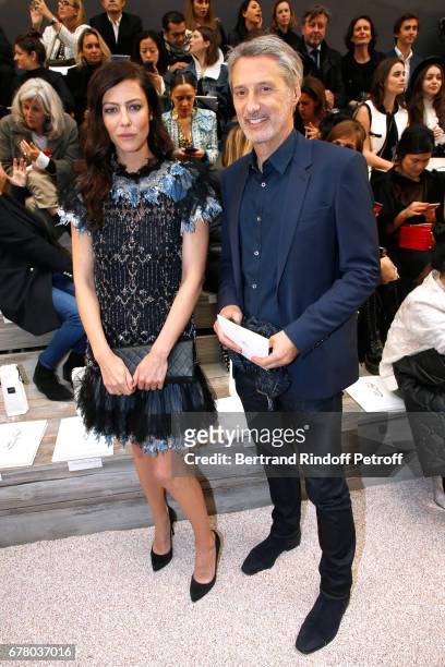 Anna Mouglalis and Antoine de Caunes attend the Chanel Cruise 2017/2018 Collection Show at Grand Palais on May 3, 2017 in Paris, France.