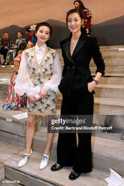 Liu Shishi and Liu Wen attend the Chanel Cruise 2017/2018 Collection Show at Grand Palais on May 3, 2017 in Paris, France.