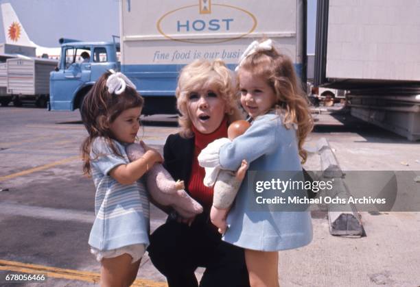 Actress Connie Stevens attends an event with her daughters Joely Fisher and Tricia Leigh Fisher in circa 1970.