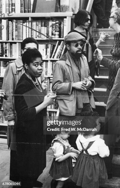 American poet and playwright LeRoi Jones and his wife, fellow poet and author Hettie Cohen Jones , speak with unidentified others at a party held in...