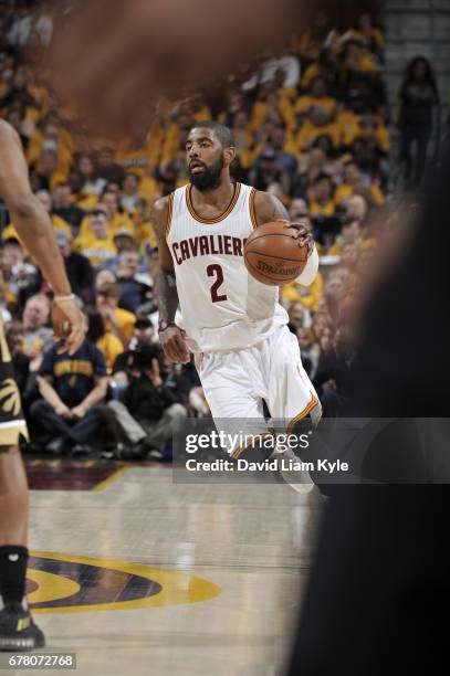 Kyrie Irving of the Cleveland Cavaliers handles the ball against the Toronto Raptors during Game Two of the Eastern Conference Semifinals of the 2017...