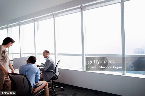 diverse business colleagues talking in office - corporate modern office bright diverse imagens e fotografias de stock