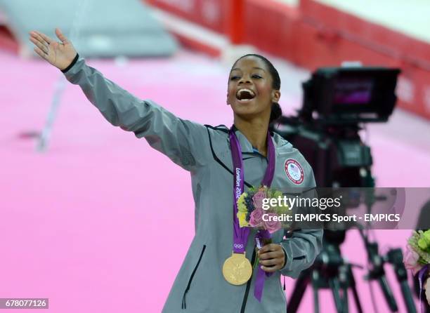 S Gabrielle Douglas celebrates winning the gold medal during the Artistic Gymnastic Women's All round Final at the North Greenwich Arena, London.