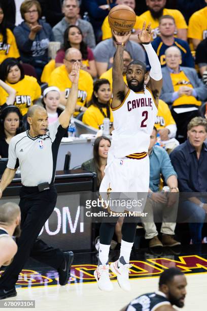 Kyrie Irving of the Cleveland Cavaliers shoots a three-point shot during the first half of Game Two of the NBA Eastern Conference semifinals against...
