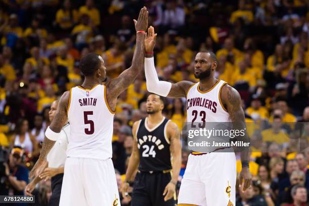 Smith of the Cleveland Cavaliers celebrates with LeBron James during the second half of Game Two of the NBA Eastern Conference semifinals against the...