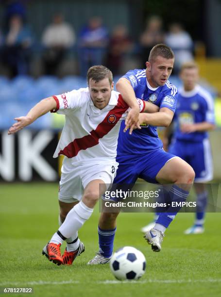 United's Lee Neville and Macclesfield Town's Waide Fairhurst battle for the ball