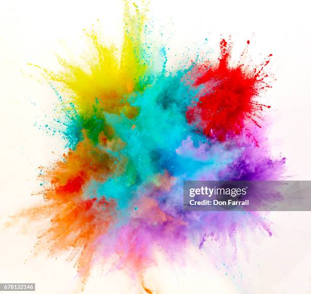 exploding colored powder - colors fotografías e imágenes de stock