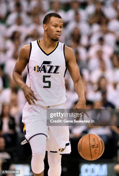 Rodney Hood of the Utah Jazz brings the ball up court in the first half against the Los Angeles Clippers in Game Four of the Western Conference...