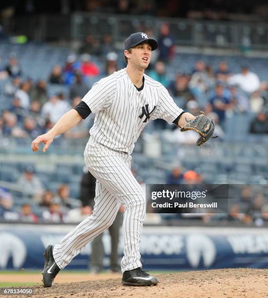 Pitcher Bryan Mitchell of the New York Yankees reacts on the mound during the 11th inning of an MLB baseball game against the Baltimore Orioles on...