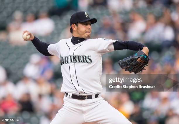 Starter Hisashi Iwakuma of the Seattle Mariners delivers a pitch during the first inning of a game against the Los Angeles Angels of Anaheim at...