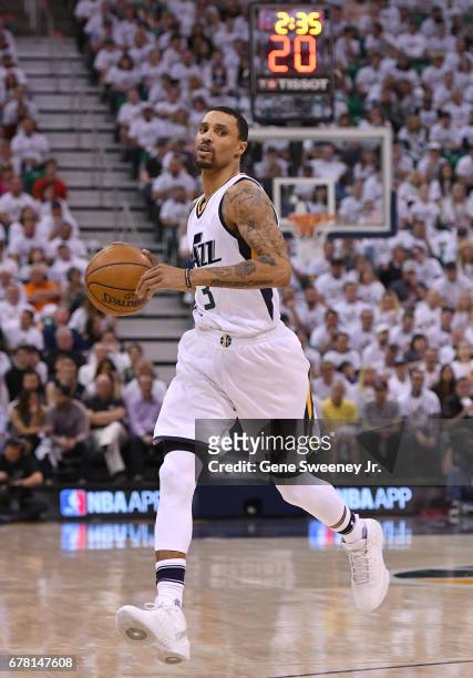 George Hill of the Utah Jazz controls the ball in the first half against the Los Angeles Clippers in Game Four of the Western Conference...