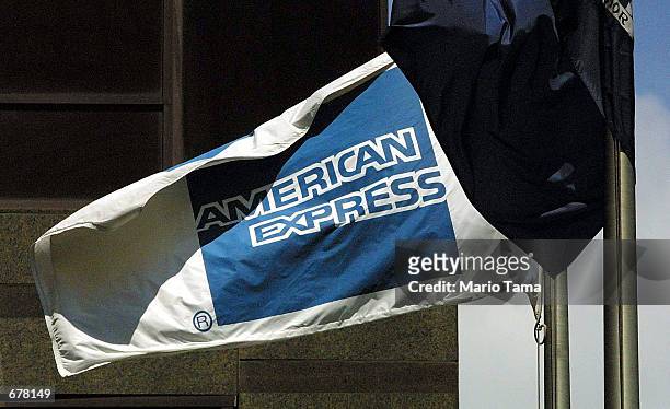 An American Express flag blows in the wind in front of the American Express corporate headquarter building July19, 2001 in New York City. The...