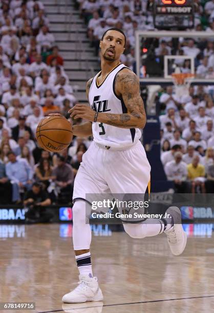 George Hill of the Utah Jazz controls the ball in the first half against the Los Angeles Clippers in Game Four of the Western Conference...