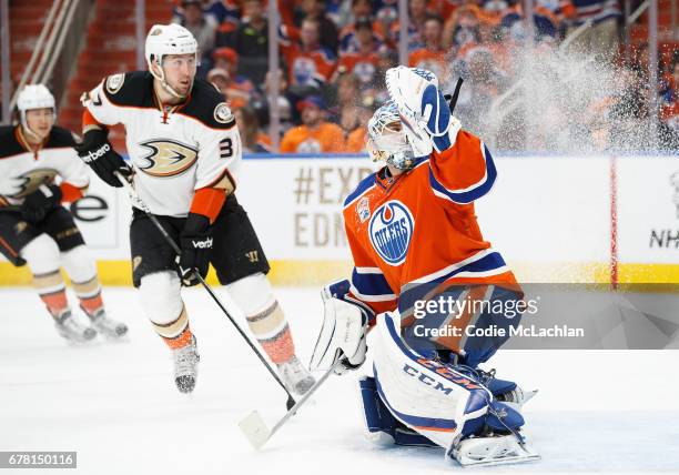 Goalie Cam Talbot of the Edmonton Oilers makes a save against Nick Ritchie of the Anaheim Ducks in Game Four of the Western Conference Second Round...