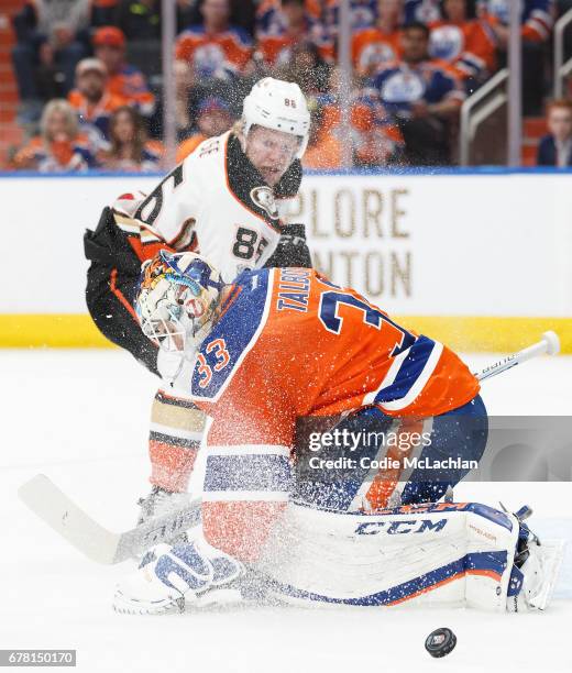 Goalie Cam Talbot of the Edmonton Oilers makes a save against Ondrej Kase of the Anaheim Ducks in Game Four of the Western Conference Second Round...