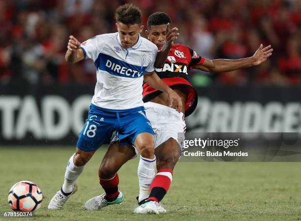 Marcio Araujo of Flamengo struggles for the ball with Diego Buonanotte of Universidad Catolica during a match between Flamengo and Universidad...