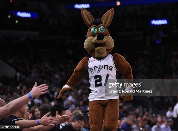 The mascot of the San Antonio Spurs walks the sideline during Game Two of the NBA Western Conference Semi-Finals against the Houston Rockets at AT&T...