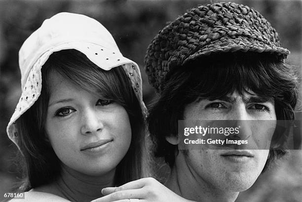Beatles guitarist George Harrison honeymoons with his wife Patti Boyd February 14, 1966 in Barbados. Harrison died in Los Angeles after a long battle...