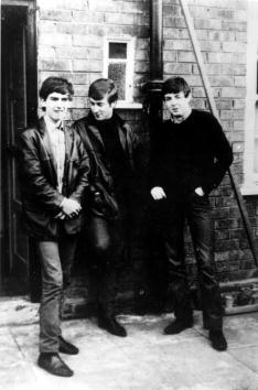 George Harrison Injuries The Beatles George Harrison, John Lennon and Paul McCartney, stand ...