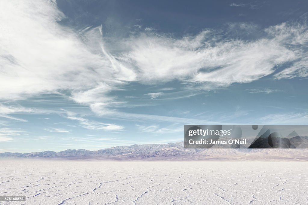 Salt flat with distant mountains