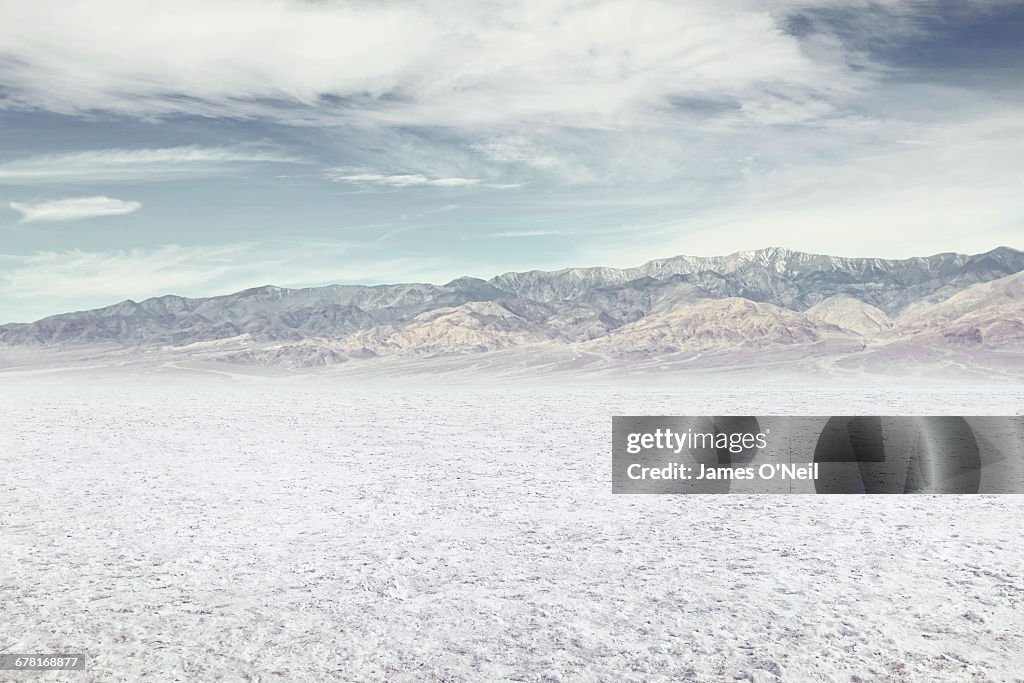 Salt flat with distant mountains