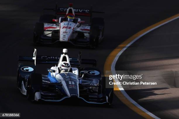 Max Chilton of Great Britain, driver of the Chip Ganassi Racing Honda and Sebastien Bourdais of France, driver of the Dale Coyne Racing Hondadrive...