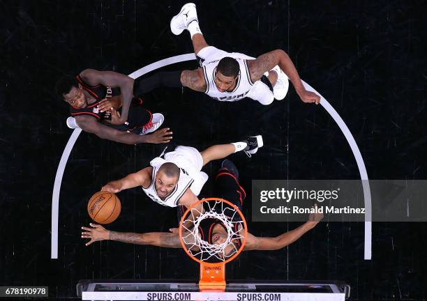 Tony Parker of the San Antonio Spurs takes a shot against Trevor Ariza of the Houston Rockets during Game Two of the NBA Western Conference...