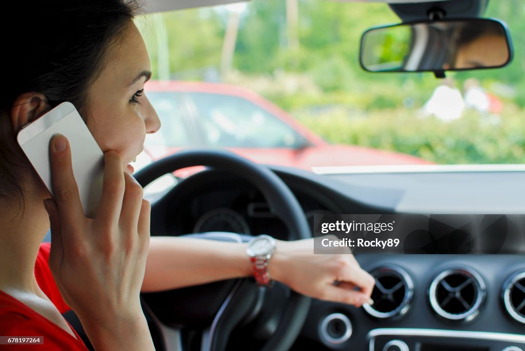 Woman on the phone in the car