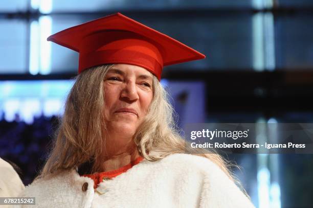 American musician and authoress Patti Smith receives an honorary degree in Literature from the University of Parma during a ceremony at Audtorium...