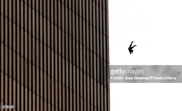 Man falls to his death from the World Trade Center after two planes hit the twin towers September 11, 2001 in New York City in an terrorist attack.