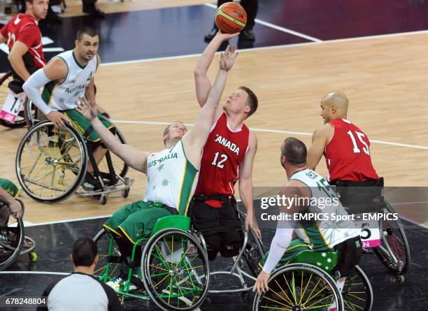 Australia's Shaun Norris and Canada's Patrick Anderson compete for possession during the men's wheelchair basketball final between Australia and...