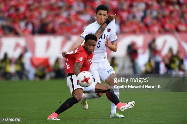 Rafael Silva of Urawa Red Diamonds controls the ball under pressure of Naomichi Ueda of Kashima Antlers during the J.League J1 match between Urawa...