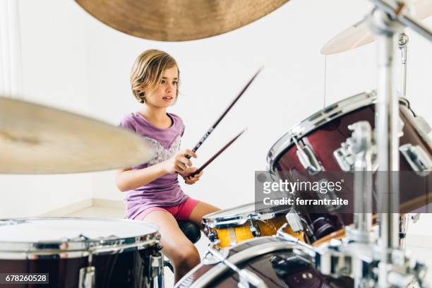little girl playing drums - hitting drum stock pictures, royalty-free photos & images