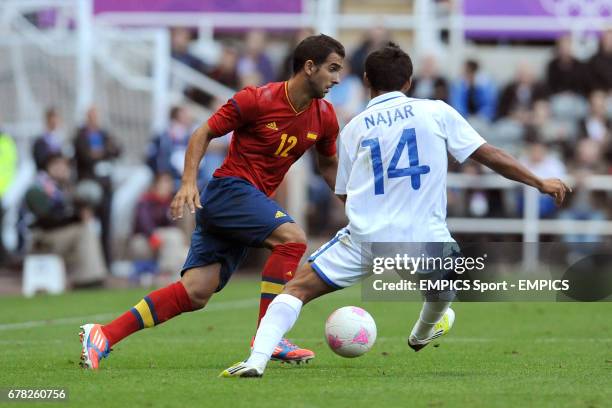Spain's Martin Montoya and Andy Najar of Honduras fight for possession of the ball