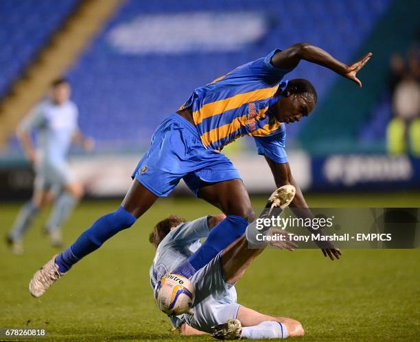 Coventry City's Kevin Kilbane slides in on Shrewsbury Town's Jermaine Grandison