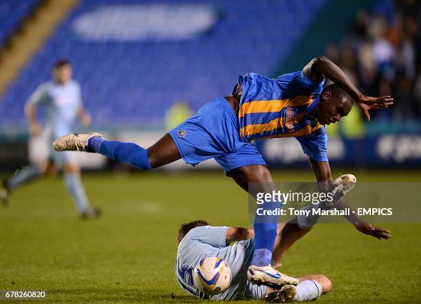 Coventry City's Kevin Kilbane slides in on Shrewsbury Town's Jermaine Grandison